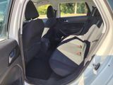 a white car with black seats in the back of it