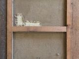 an old picture frame with a picture of a bird in it