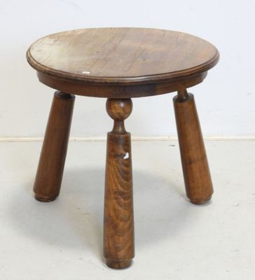 a small wooden table with two legs and a wooden top