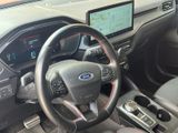 a steering wheel and dashboard of a car in a car showroom