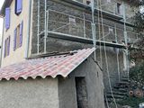 an image of a house under construction with scaffolding around it