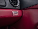 a close up of a car dashboard with a badge on it