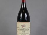 a bottle of wine that is sitting on a table