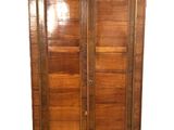 an image of a wooden armoire with a mirror on top of it
