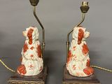 pair of porcelain dogs on marble bases with candles