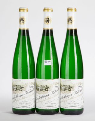 three bottles of wine sitting next to each other on a table