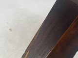 a close up of a wooden table with a white background