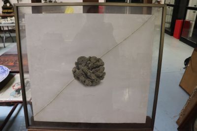 a picture of a picture of a rock in a glass case