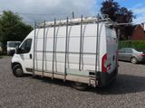 a white van that is parked in a parking lot