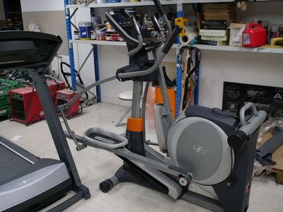 a gym room with a treadie and a treadie machine