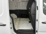 a white van with a bed in the back of it
