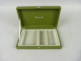 an image of a green box with a watch inside of it