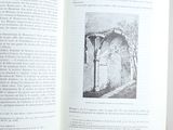 an open book with a picture of a building in it