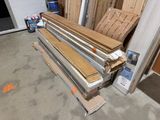 several pieces of wood are stacked on top of each other in a garage