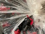 a plastic bag filled with red and black items