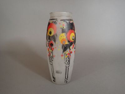 a white vase with a red and yellow design on it
