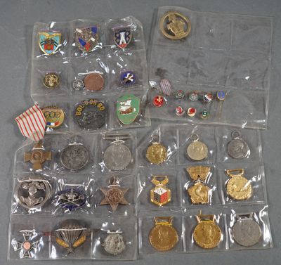 many different types of badges and pins in the bag