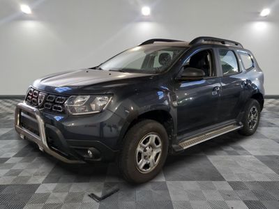 a picture of a grey dacia parked in a garage