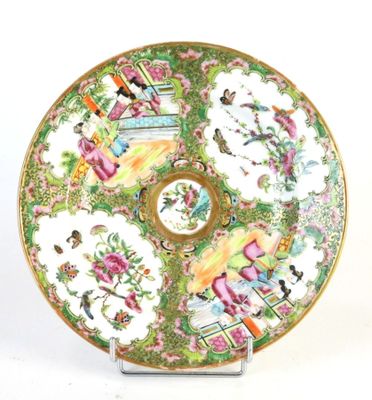a plate that has a picture of people on it