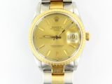 an image of a gold and silver rolex watch on a white background