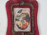 a picture of a picture of a woman and a child in a red frame
