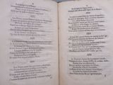 an open book with a poem in it on a table