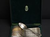a box with silverware in it on a black surface