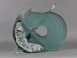 a glass sculpture of a woman on a wave