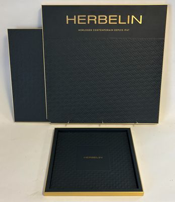 a black box with a gold logo on it and a black box with a gold logo on it
