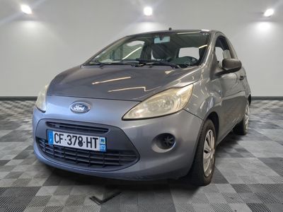 a picture of a small car parked in a garage