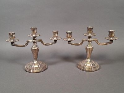 pair of silver plated candelabs with candlesticks on stands