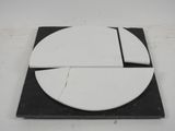 a black and white plate with a piece of pie on it