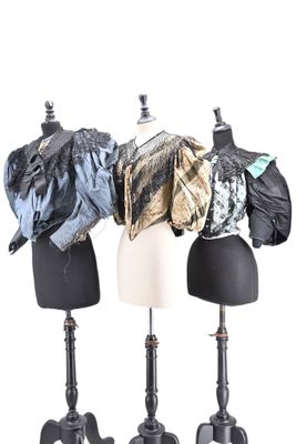 three mannequins with different types of clothing on them