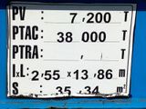 a sign on the side of a blue bus