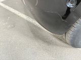 a close up of a car ' s tire with a hole in it