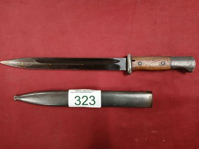 two knives are on a red surface with a price tag