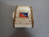 a small white box with a red and blue label on it