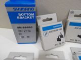 three boxes of shimano brake pads and one box of shimano brake pads