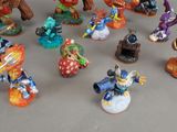 many figurines of different characters displayed on a table