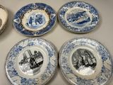 six blue and white plates with pictures of people on them