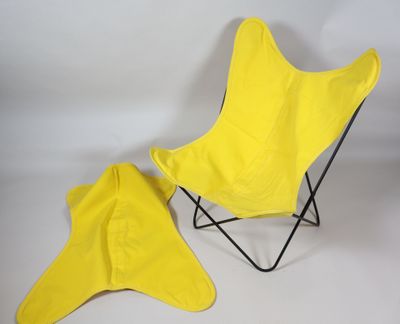 a yellow butterfly chair and a yellow umbrella on a white background