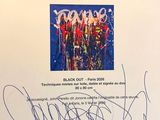 a picture of a signed book with a picture of a group of people