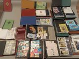 a table with many different types of books on it