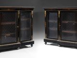 pair of antique black and gold display cabinets with glass doors