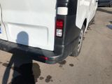 a white van that is parked in a parking lot