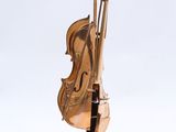 sculpture of a violin on a marble base on a white background