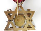 star of david medal with red ribbon and star of david medallion