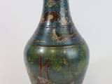 a vase that has a picture of a dragon on it