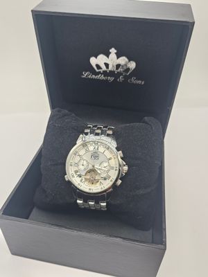 the watch is in a black box with a white horse on it