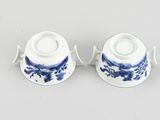 pair of blue and white porcelain cups and saucers